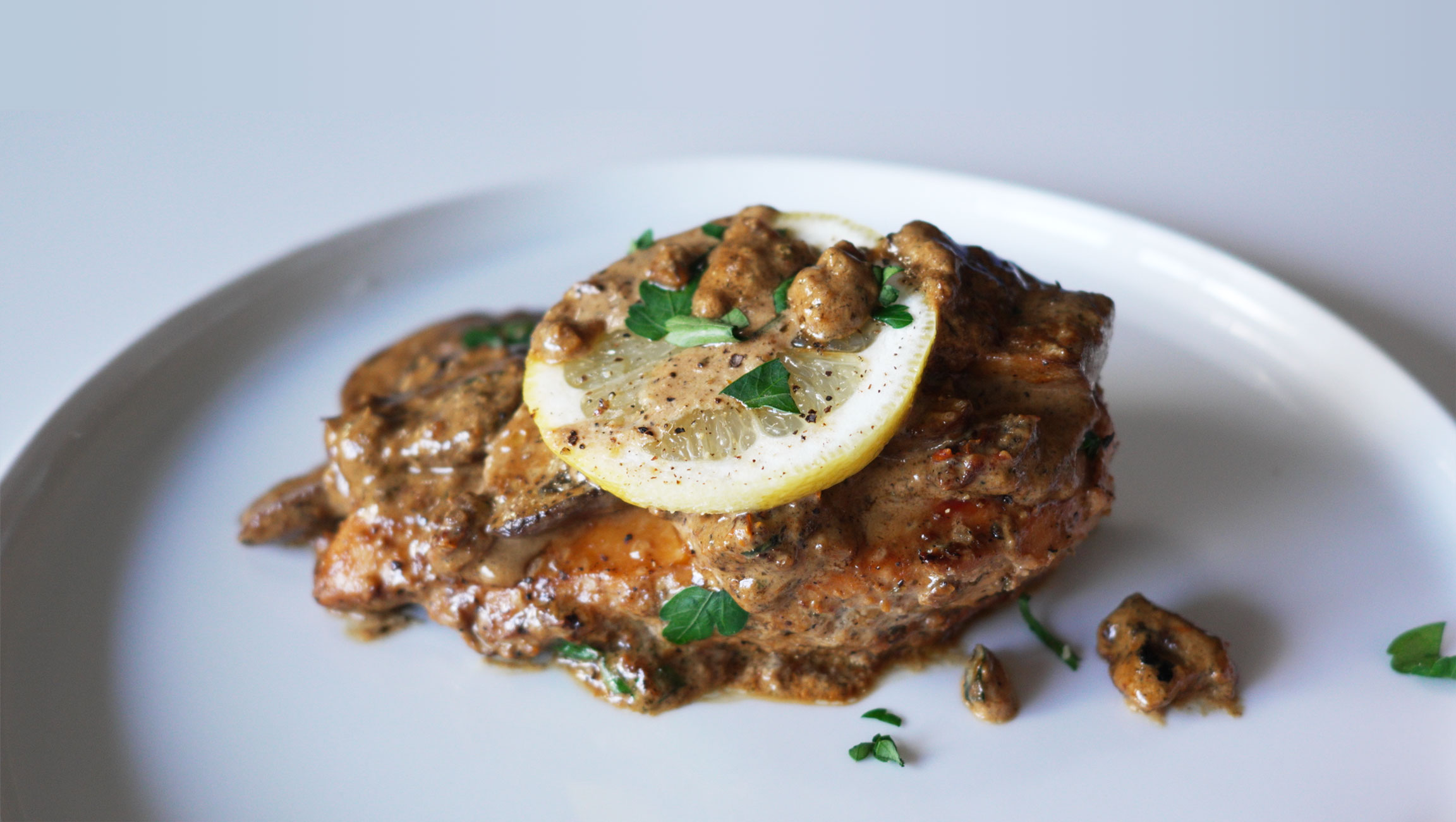 Easy lemon chicken with mushrooms served with grilled zucchini